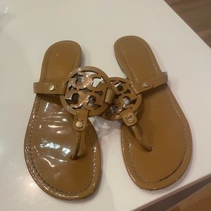 Tory Burch nude patent leather sandals in women’s size 8.